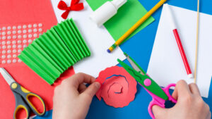 construction paper, scissors, and glue for a kid's craft project.